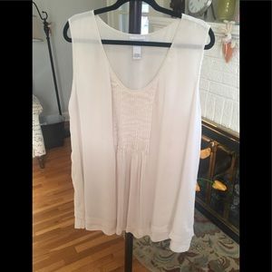 Cream sleeveless tiered blouse w/ smocking detail